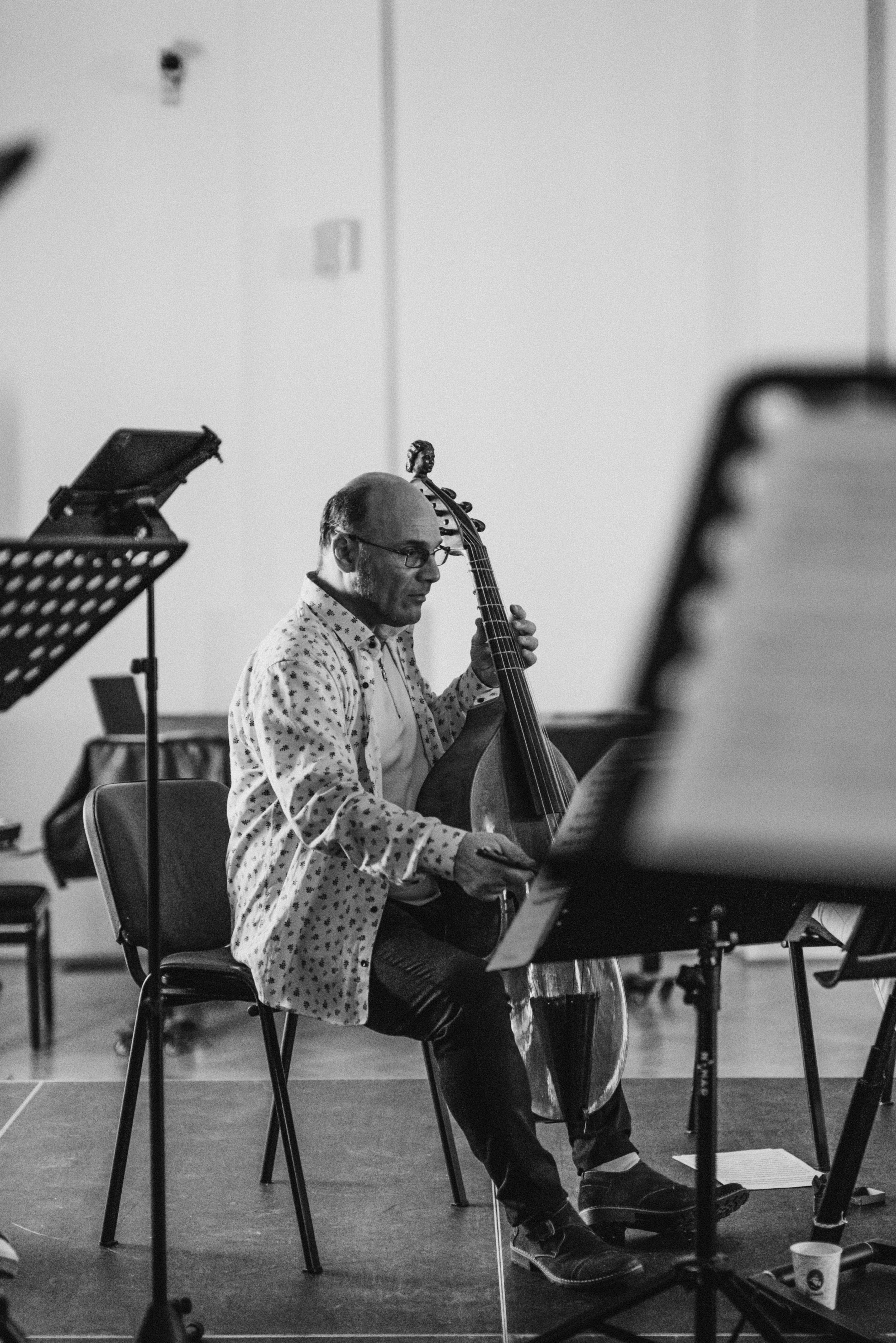 Musician with a historical string instrument during rehearsal for The Bridge Cantata